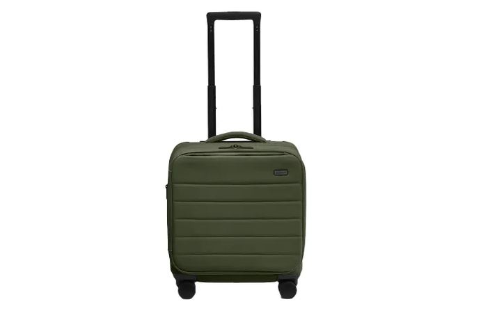packed interior of the suitcase showing the compression panel in use with folded clothing