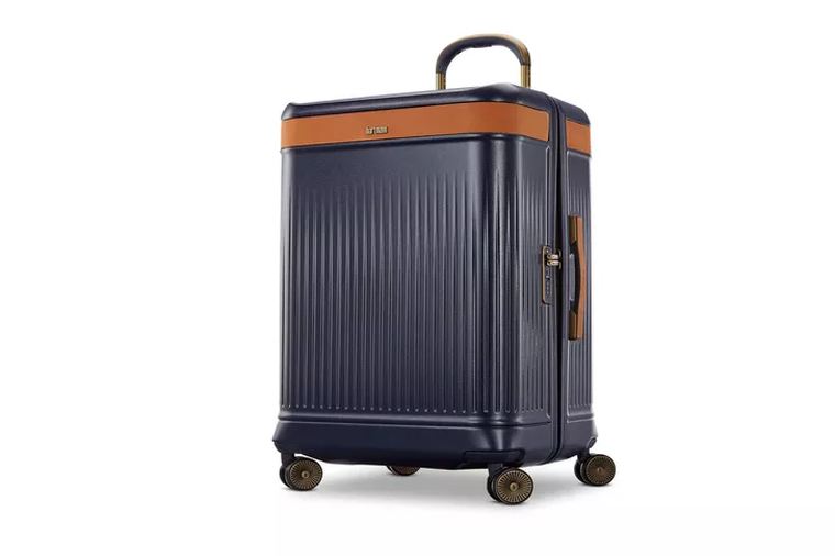Open front pocket of a carry-on showing laptop and tablet compartments