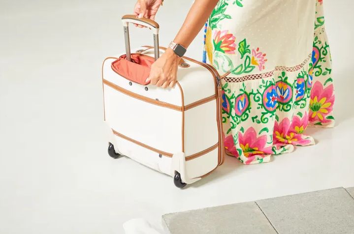 overhead shot of packed carry-on interior showing compression straps and shoe pocket