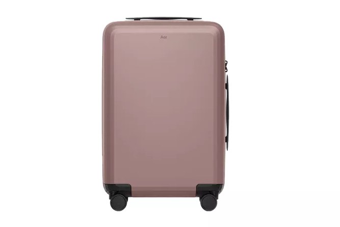 carry-on size checker at airport gate with Level8 case being measured