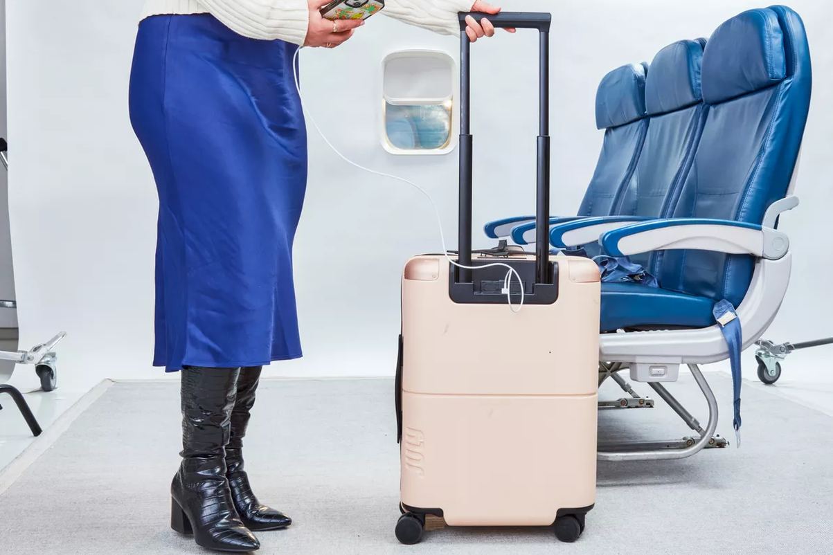 colorful Level8 carry-on on airport shuttle luggage rack